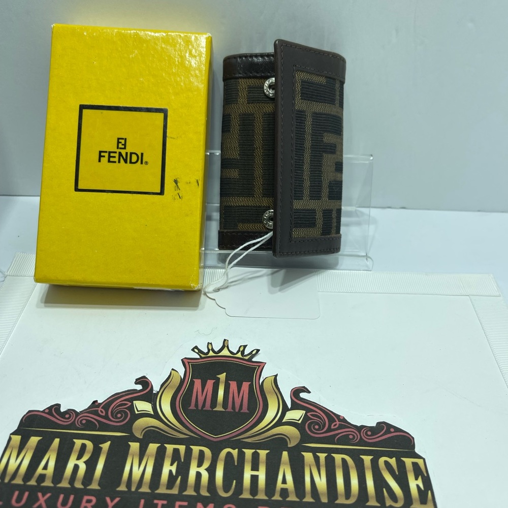 Fendi Zucca 4 Key Holder comes with box.